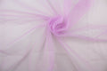A sheer, light weight, and semi firm tricot in light purple