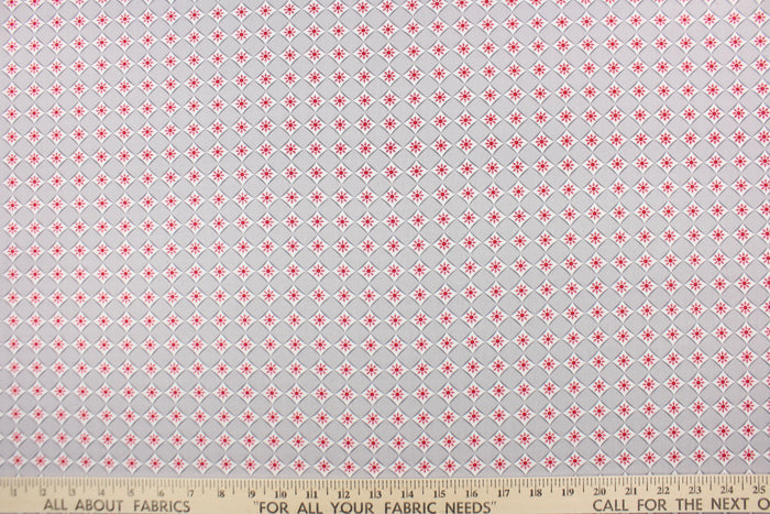 This is a cute and simple print of diamonds and snowflakes.  The versatile lightweight fabric is soft and easy to sew.  It would be great for quilting, crafting and sewing projects.  Colors include red, grey and white.