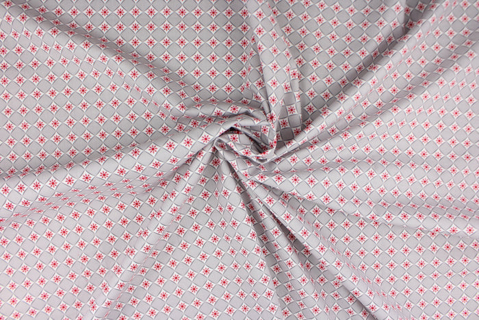 This is a cute and simple print of diamonds and snowflakes.  The versatile lightweight fabric is soft and easy to sew.  It would be great for quilting, crafting and sewing projects.  Colors include red, grey and white.