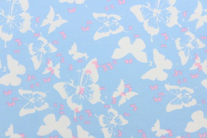 Think of a warm, sunny, summer day with this fabric featuring large and small butterflies in pink and white on a baby blue background.  The versatile lightweight fabric is soft and easy to sew.  It would be great for quilting, crafting and sewing projects.