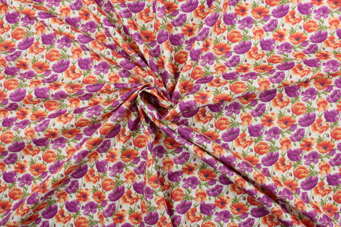 From the "Cats N Quilts" collection, Poppies in Bloom features large, vibrant poppy flowers in purple and orange on a white background.  The versatile lightweight fabric is soft and easy to sew.  It would be great for quilting, crafting and sewing projects.