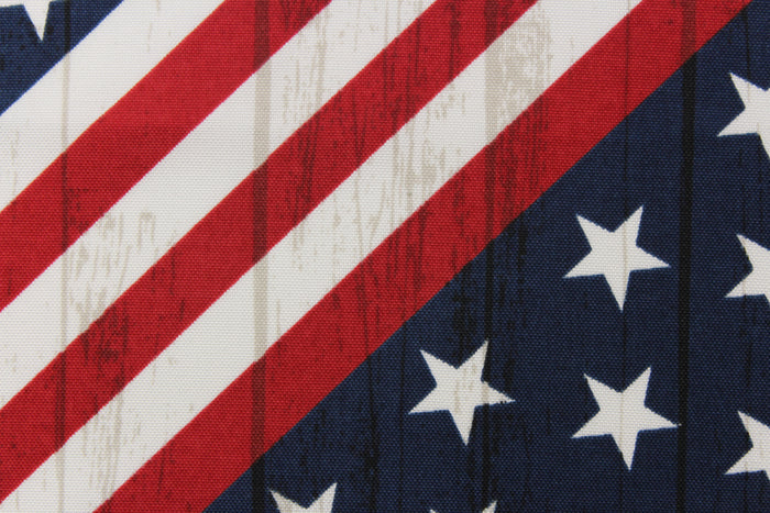 This fabric features an American flag in a diagonal direction with a wood grain look.