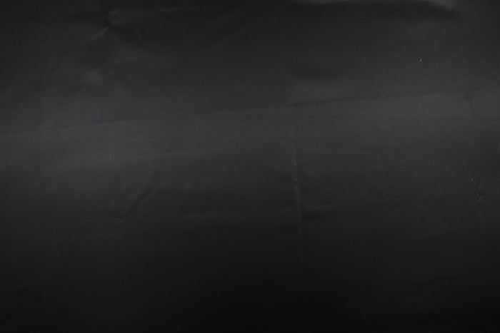 A beautiful satin fabric in a black color.