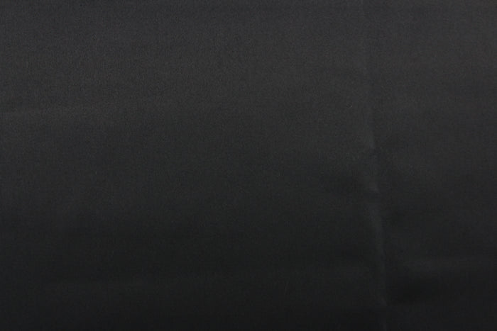 A beautiful satin fabric in a black color.