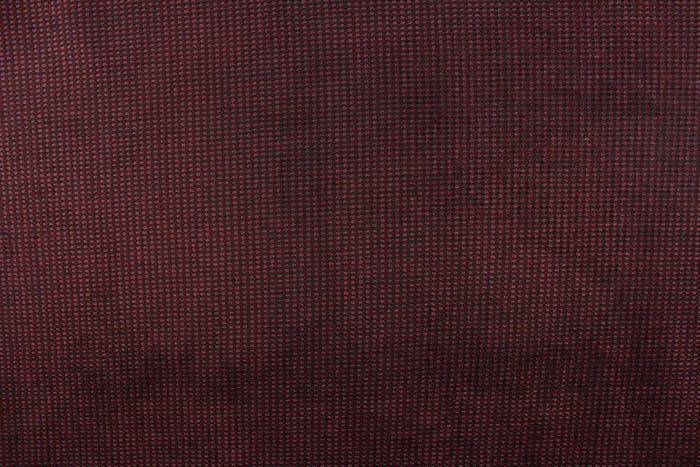 This duotone hard wearing, textured chenille fabric in burgundy with black accents would be a beautiful accent to your home decor.