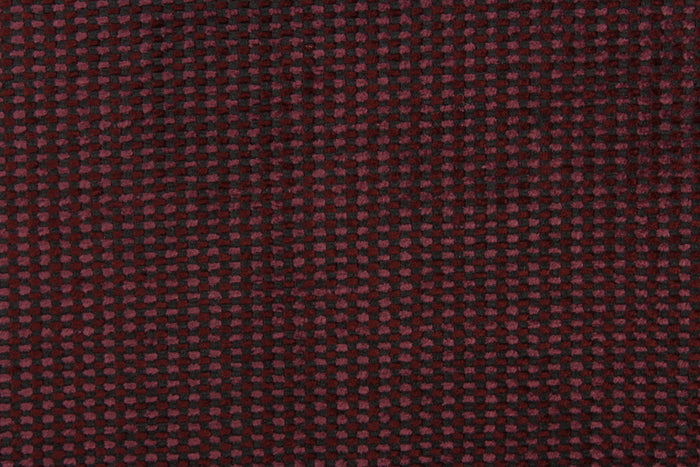This duotone hard wearing, textured chenille fabric in burgundy with black accents would be a beautiful accent to your home decor.