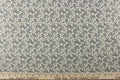 A fun paisley design in basic color of  blue set against a cream background.
