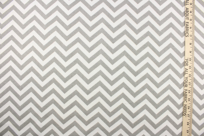 This printed flannel features a chevron pattern in grey and white.  Uses include apparel, bedding, pillows, home decor and crafting.  This fabric has a soft workable feel.