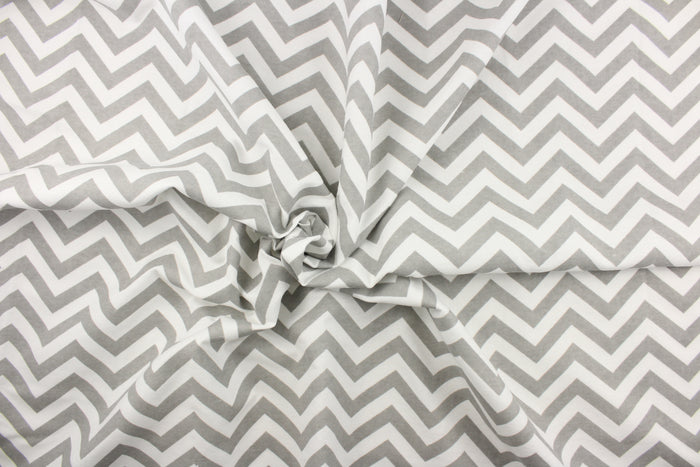 This printed flannel features a chevron pattern in grey and white.  Uses include apparel, bedding, pillows, home decor and crafting.  This fabric has a soft workable feel.