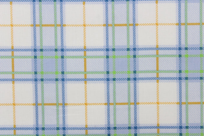 This quilting print features a plaid design in blue, white, green, and a orangey yellow.