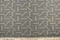 This high end upholstery weight fabric features a geometric design in blue and beige on a metal gray background.  It is suited for uses that requires a more durable fabric.  The reinforced backing makes it great for upholstery projects including sofas, chairs, dining chairs, pillows, handbags and craft projects.  It is soft and pliable and would make a great accent to any room.