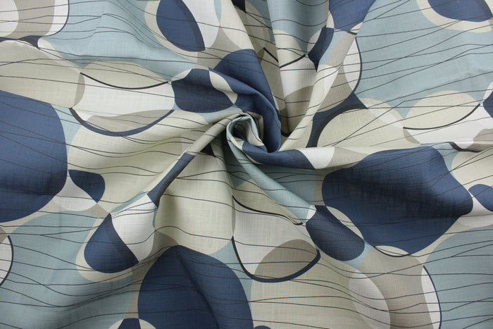 Covington© Ukito in Harbor is a versatile fabric with a contemporary print featuring shades of blue, black, light teal, and creams.  With an impressive 50,000 double rub count, this multipurpose fabric is durable and perfect for any project.  The fabric is perfect for window accents (draperies, valances, curtains and swags) cornice boards, accent pillows, bedding, headboards, cushions, ottomans, slipcovers and upholstery.