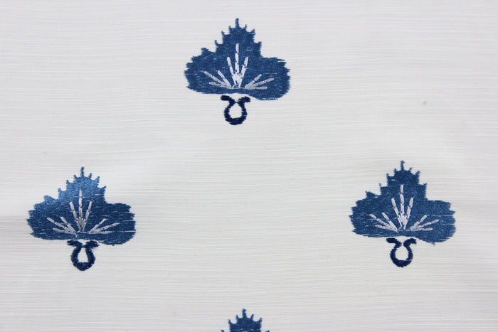 Effortlessly elevate any space with the versatile and elegant Embroidered August in Twilight.  The finely embroidered medium blue medallion with pearl grey accents, set against a white background adds a touch of sophistication to drapery, pillows, light upholstery, table runners, bedding, headboards, home décor, and even apparel. Perfect for any style or purpose.