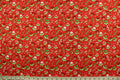 This cotton print fabric features dainty flowers in the colors of red, pink, green and white on a red background.  It has a nice soft hand and would be great for quilting, crafting and home décor.