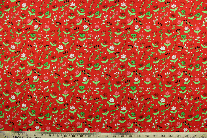 This cotton print fabric features dainty flowers in the colors of red, pink, green and white on a red background.  It has a nice soft hand and would be great for quilting, crafting and home décor.