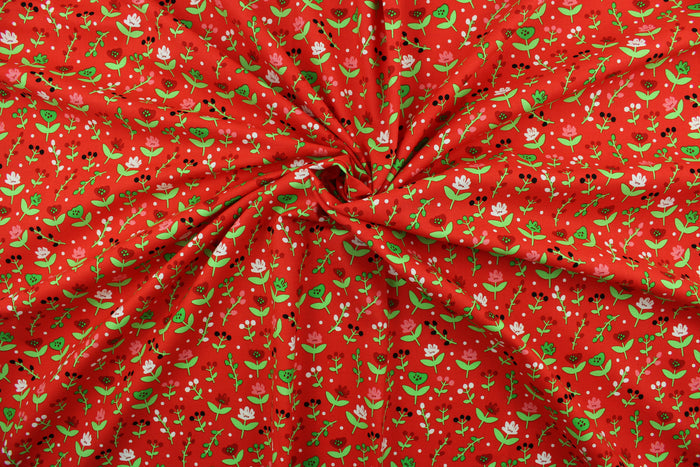This cotton print fabric features dainty flowers in the colors of red, pink, green and white on a red background.  It has a nice soft hand and would be great for quilting, crafting and home décor.