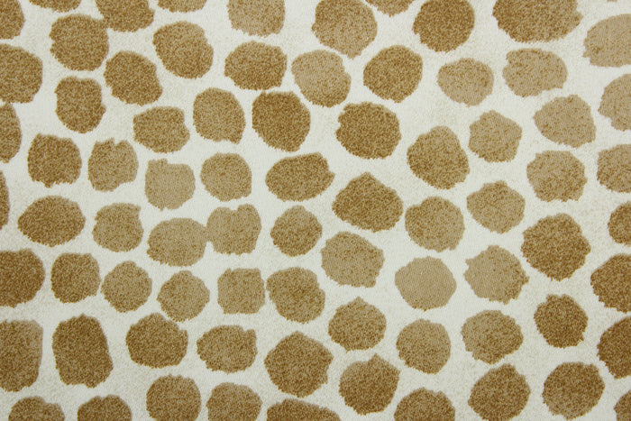 Puff Dotty is an indoor-and-outdoor upholstery fabric with a soil-and-stain repellant finish.  It features golden brown dots on a cream background, screen printed for lasting quality and beauty.  With 51,000 double rubs, it stands up to frequent use, making it great for throw pillows, chair cushions, table top accessories, tote bags, and more.