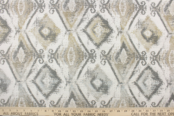 This jacquard features a diamond design in varying shades of gray and taupe .