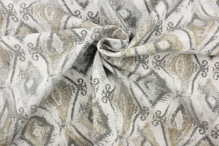 This jacquard features a diamond design in varying shades of gray and taupe .