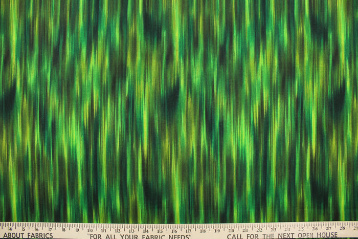 This fabric features stripes in varying shades of green with hints of black that blend together to create a beautiful color palette.  It has a nice soft hand and would be great for quilting, crafting and home decor.  We offer this pattern in several different colors.