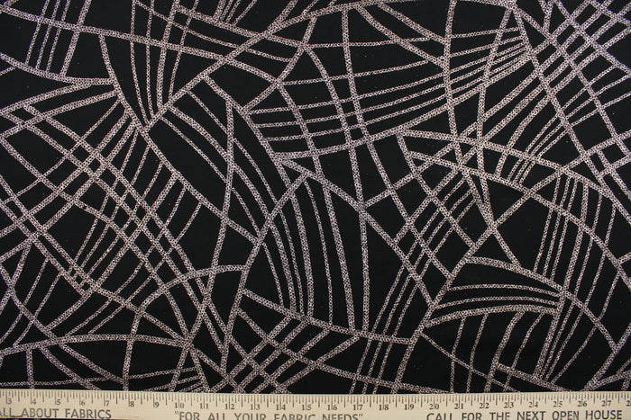 This 4 way stretch lycra blend fabric in black with rose gold sparkle accents is durable and breathable and will allow movements of the body. Uses include dance and sports wear, leotards and dresses.  We offer several different lycra fabrics.