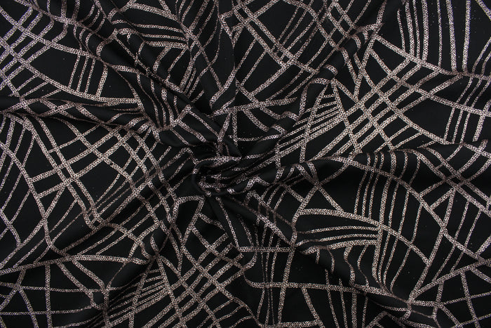 This 4 way stretch lycra blend fabric in black with rose gold sparkle accents is durable and breathable and will allow movements of the body. Uses include dance and sports wear, leotards and dresses.  We offer several different lycra fabrics.