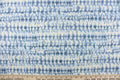 This fabric features an abstract design in varying shades of blue and white.