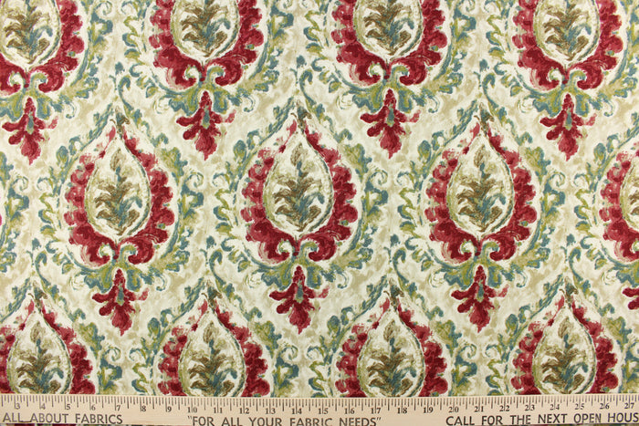 This fabric features a damask design in green, teal, cherry red, brown, beige, and cream.