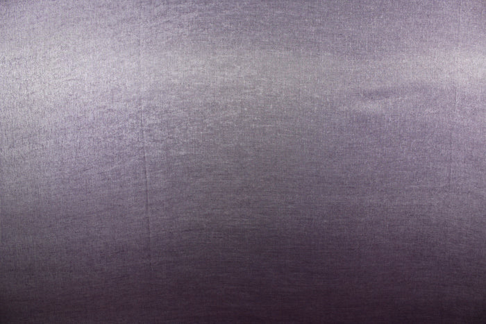 This taffeta fabric in iridescent in a gray purple.