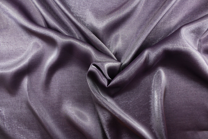 This taffeta fabric in iridescent in a gray purple.