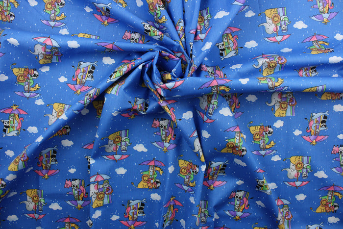 Featuring a classic cartoon print of Noah's Ark, this cheerful design will bring a touch of fun to your home.  An array of bright colors, like pink, purple, yellow, green, black, and white, contrast against a bold blue background, and the addition of clouds, raindrops, and umbrellas make this fabric truly eye-catching.  The high-quality cotton material ensures lasting durability and softness.  It would be great for apparel, quilting, crafting and sewing projects.