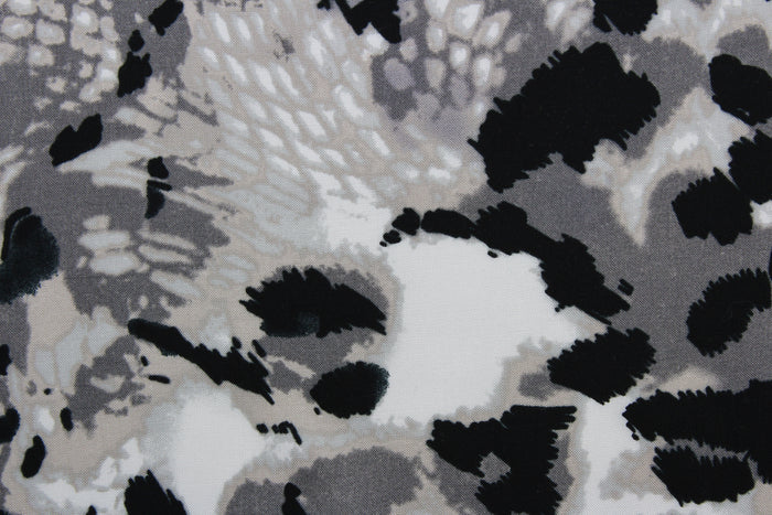 Featuring an eye-catching ocelot print in black, white, shades of gray, and light beige, the unique pattern stands out while the classic colors blend in for a sophisticated and timeless look.  The high-quality cotton material ensures lasting durability and softness.  It would be great for apparel, quilting, crafting and sewing projects.