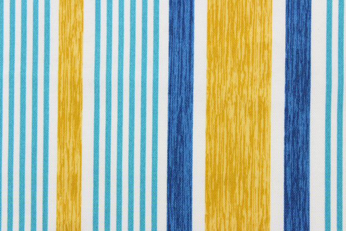 This outdoor fabric features a stripe design in blue, white, golden tan, and aqua.