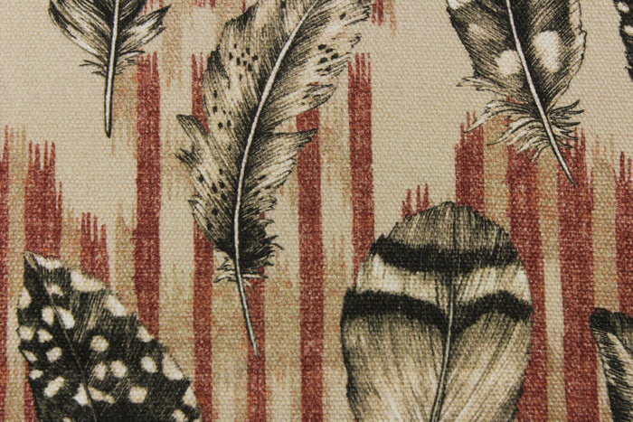 The cayenne color features a finely detailed feathers on a muted red stripe with black feathers on a tan background.