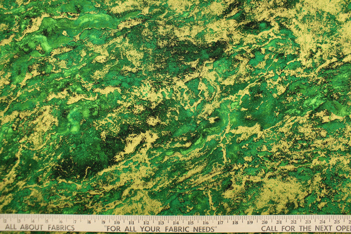 A marble design in varying shades of green and gold with hints of black .