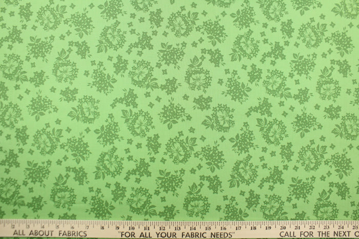 A floral design in green .