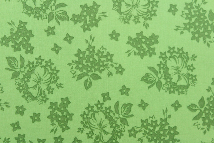 A floral design in green .