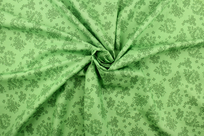 A floral design in green .