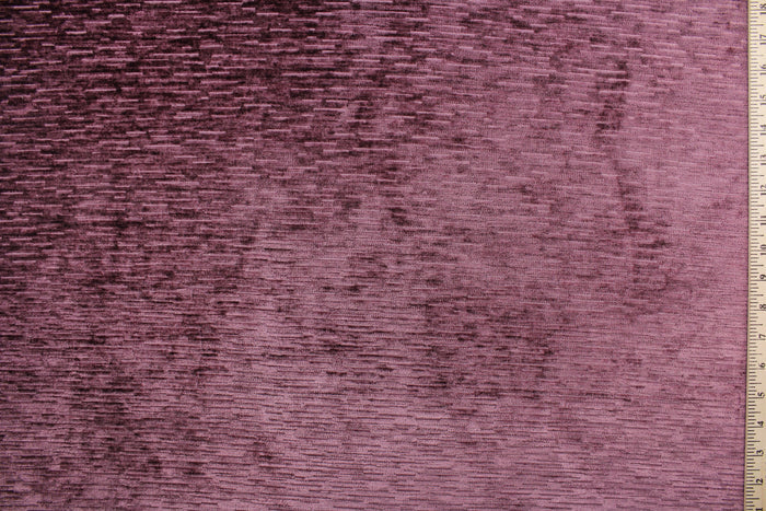 Driftwood is crafted from a luxurious chenille fabric with a ribbed texture in a stunning mulberry hue.  The soft, textured look adds an inviting touch to any room.  This high end upholstery weight fabric is suited for uses that requires a more hard wearing fabric.  It is great for upholstery projects including sofas, chairs, dining chairs, pillows, handbags and craft projects.