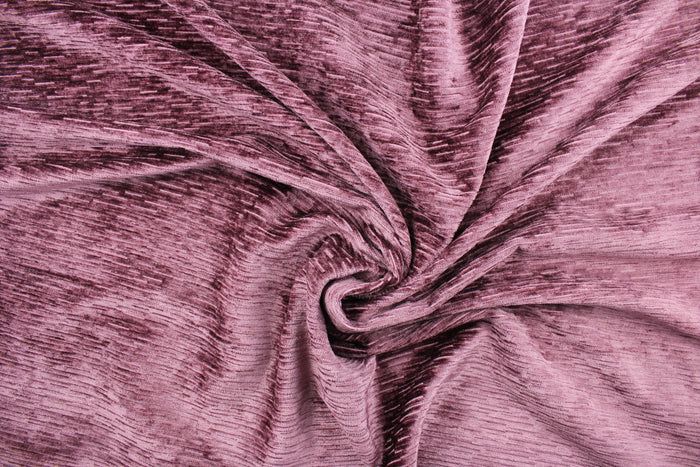 Driftwood is crafted from a luxurious chenille fabric with a ribbed texture in a stunning mulberry hue.  The soft, textured look adds an inviting touch to any room.  This high end upholstery weight fabric is suited for uses that requires a more hard wearing fabric.  It is great for upholstery projects including sofas, chairs, dining chairs, pillows, handbags and craft projects.