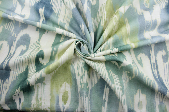 Lagrande is a multi use fabric featuring an ikat print design in blue, green and ivory.  The fabric is treated with a soil and stain repellant finish for lasting performance, rated for up to 15,000 double rubs.  The versatile fabric is perfect for window accents (draperies, valances, curtains and swags) cornice boards, accent pillows, bedding, headboards, cushions, ottomans, slipcovers and upholstery.