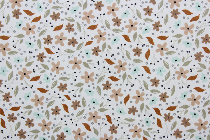 Cicely features an intricate floral pattern in shades of brown, tan, green, and black, set against a white background.  The high-quality cotton material ensures lasting durability and softness.  It would be great for apparel, quilting, crafting and sewing projects.