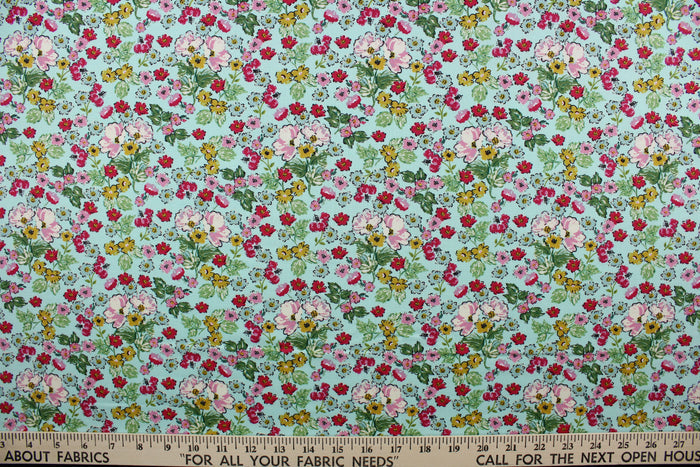 Flower Girl features a bright and cheerful floral print in a range of colors: mustard yellow, green, red, pink, white, and black on a blue background.  The high-quality cotton material ensures lasting durability and softness, making it perfect for your next quilting or stitching project.  The versatile lightweight fabric is soft and easy to sew.  It would be great for apparel, quilting, crafting and sewing projects.