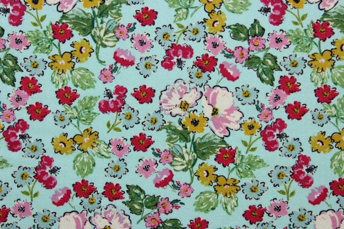 Flower Girl features a bright and cheerful floral print in a range of colors: mustard yellow, green, red, pink, white, and black on a blue background.  The high-quality cotton material ensures lasting durability and softness, making it perfect for your next quilting or stitching project.  The versatile lightweight fabric is soft and easy to sew.  It would be great for apparel, quilting, crafting and sewing projects.