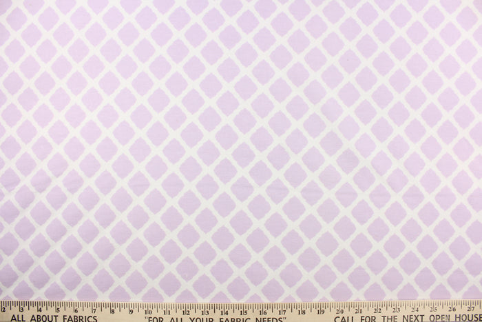 This printed flannel features a lattice design in white and lavendar.  Uses include apparel, bedding, pillows, home decor and crafting.  This fabric has a soft workable feel.