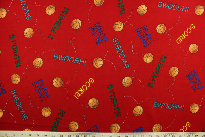 Team Teddy features basketballs and basketball terminology in orange, yellow, green, blue and teal on a red background.  The versatile lightweight fabric is soft and easy to sew.  It would be great for quilting, crafting and sewing projects.