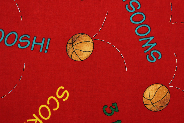 Team Teddy features basketballs and basketball terminology in orange, yellow, green, blue and teal on a red background.  The versatile lightweight fabric is soft and easy to sew.  It would be great for quilting, crafting and sewing projects.