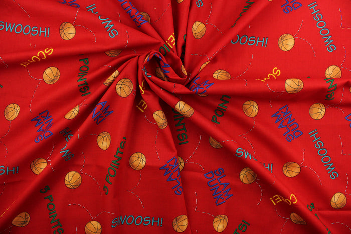 Team Teddy features basketballs and basketball terminology in orange, yellow, green, blue and teal on a red background.  The versatile lightweight fabric is soft and easy to sew.  It would be great for quilting, crafting and sewing projects.