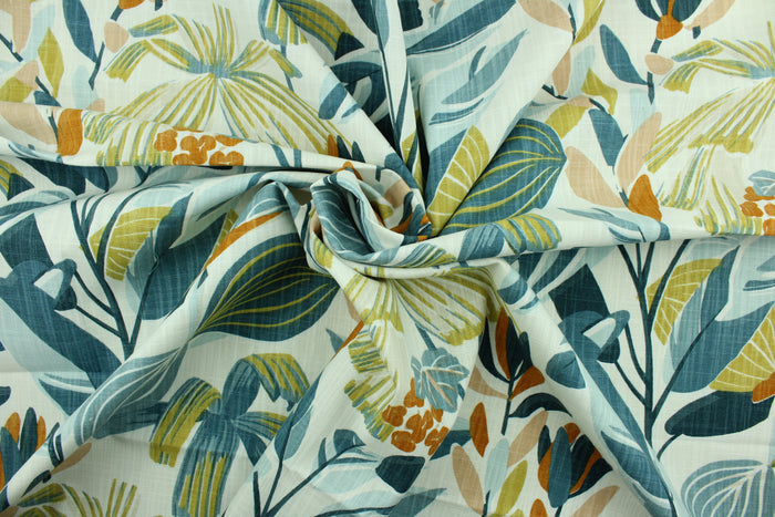 Kacey is a multi use fabric that features a large leaf and floral design in shades of blue, burnt orange, light dusty mauve and golden wheat against a white background.  It can be used for several different statement projects including window accents (drapery, curtains and swags), decorative pillows, hand bags, bed skirts, duvet covers, upholstery and craft projects.  It has a soft workable feel yet is stable and durable.