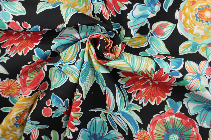 This Solarium outdoor decorative print features a large floral design in the colors of red, dark yellow, blue, white and green on a black background.  This versatile, long-lasting fabric can withstand up to 500 hours of sunlight, water and stain resistant and has 10,000 double rubs.  It is perfect for lounge cushions, pool furniture, tablecloths, decorative pillows and upholstery projects.  This fabric has a slightly stiff feel but is easy to work with.